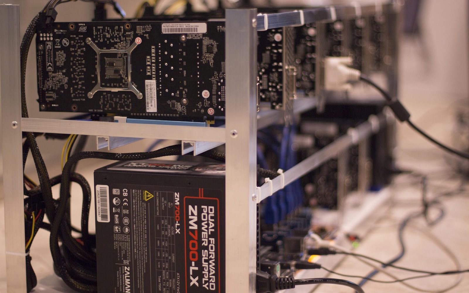 Racks of miners in a hosted facility